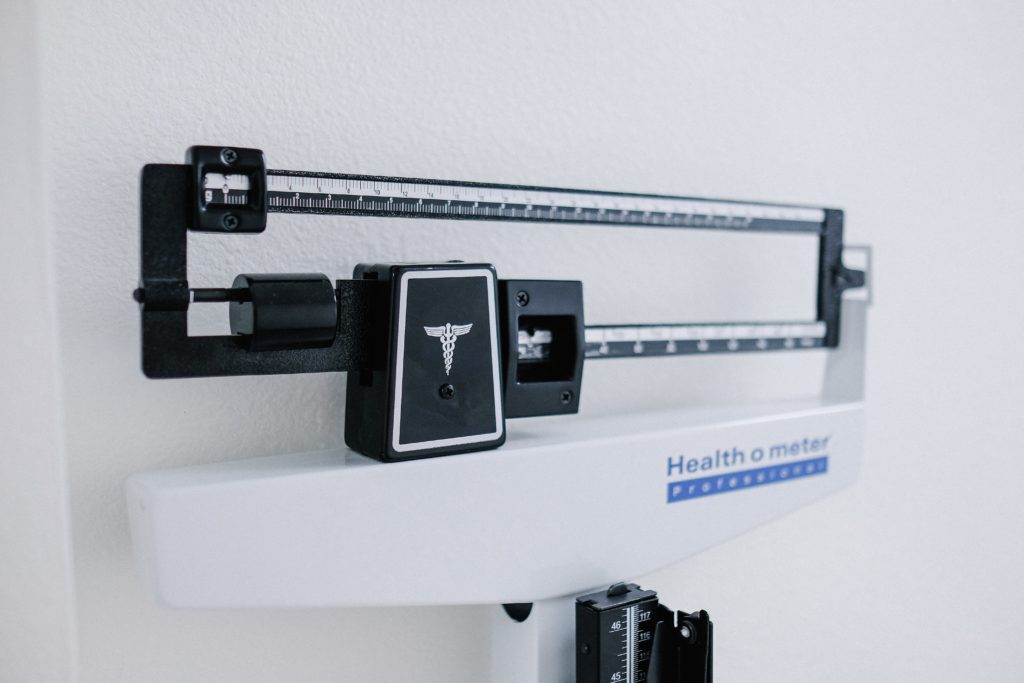 a doctor's scale with the words "health-ometer" on it
